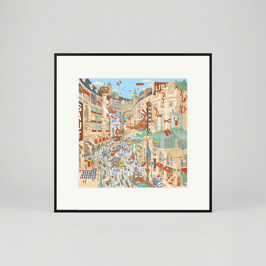 Framed artwork of a colorful city street scene on a white wall