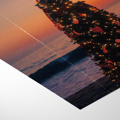 Decorative wreath with lights on a reflective surface at sunset