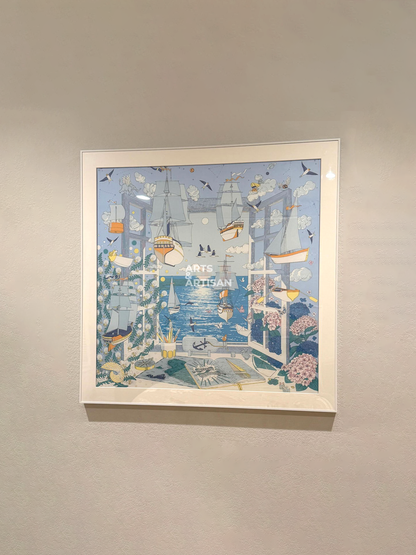 A white scarf 90 frame featuring a whimsical, detailed illustration of a harbor scene with ships, birds, and boats in soft blue, white, and beige tones, hung on a light beige wall.