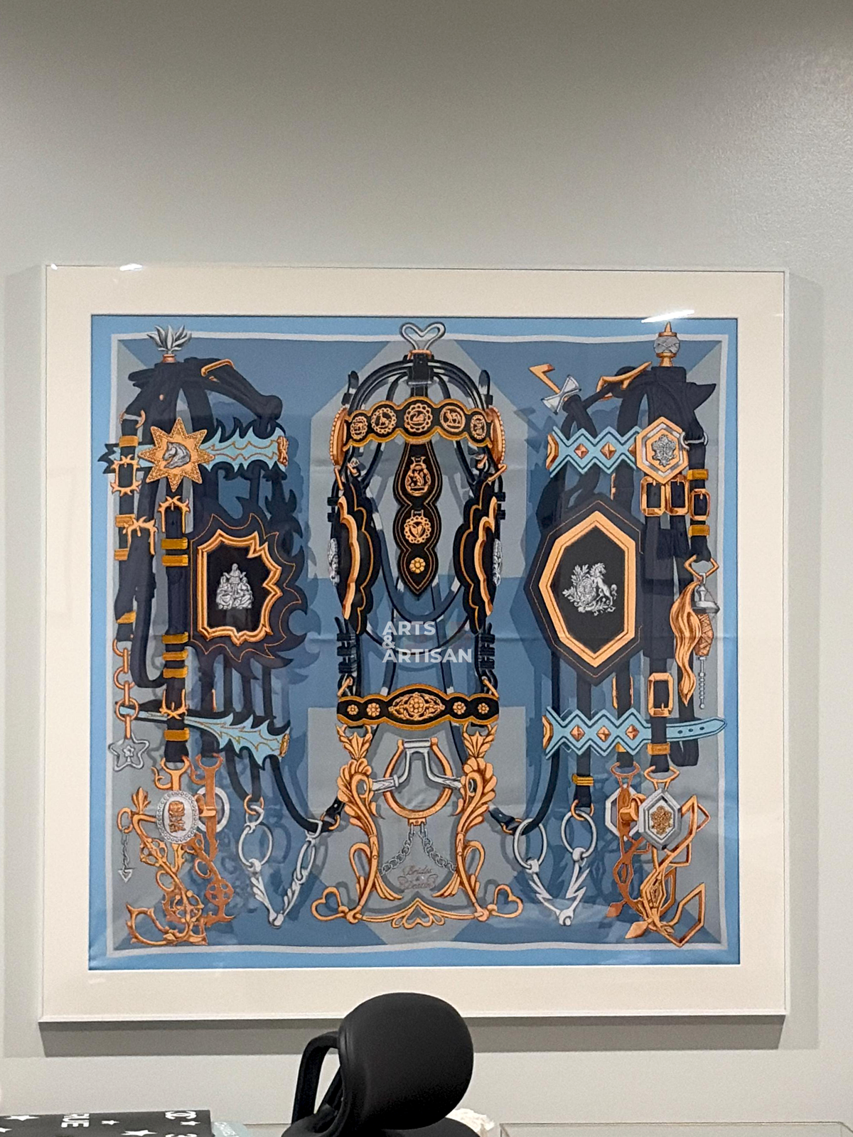 white scarf 90 frame with a hermes scarf hung on the wall
