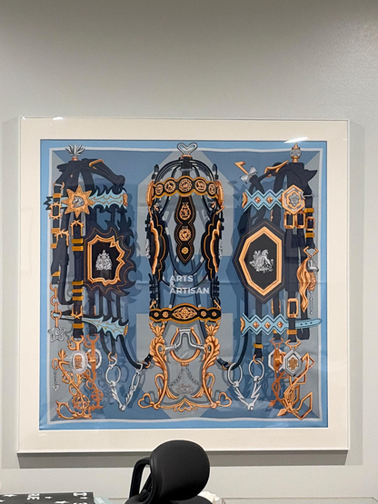white scarf 90 frame with a hermes scarf hung on the wall