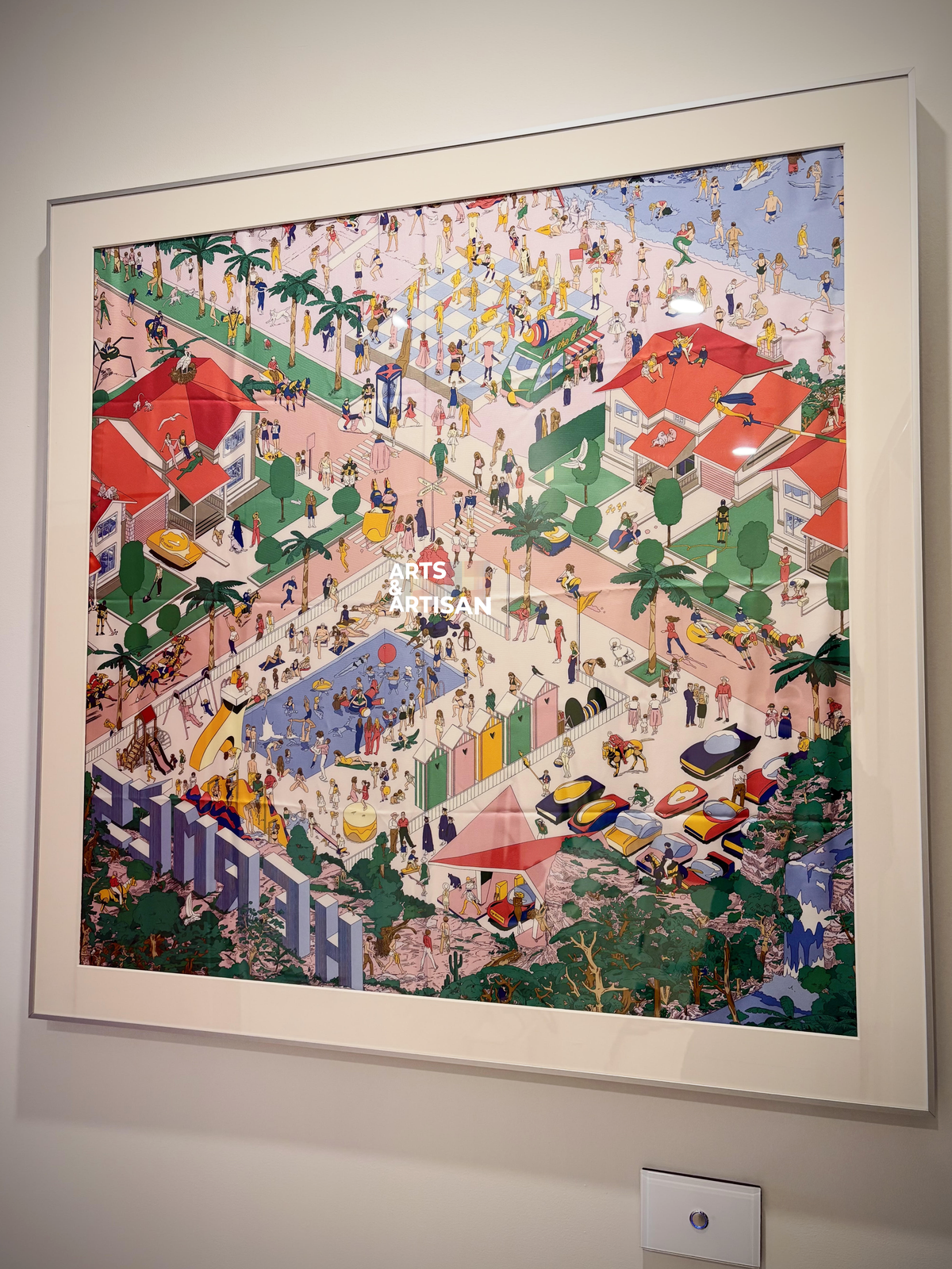 Silver Hermès scarf frame by Arts & Artisan displaying a colorful garden-print silk scarf